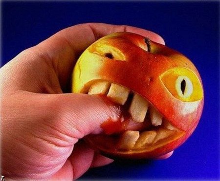 finger bitting apple